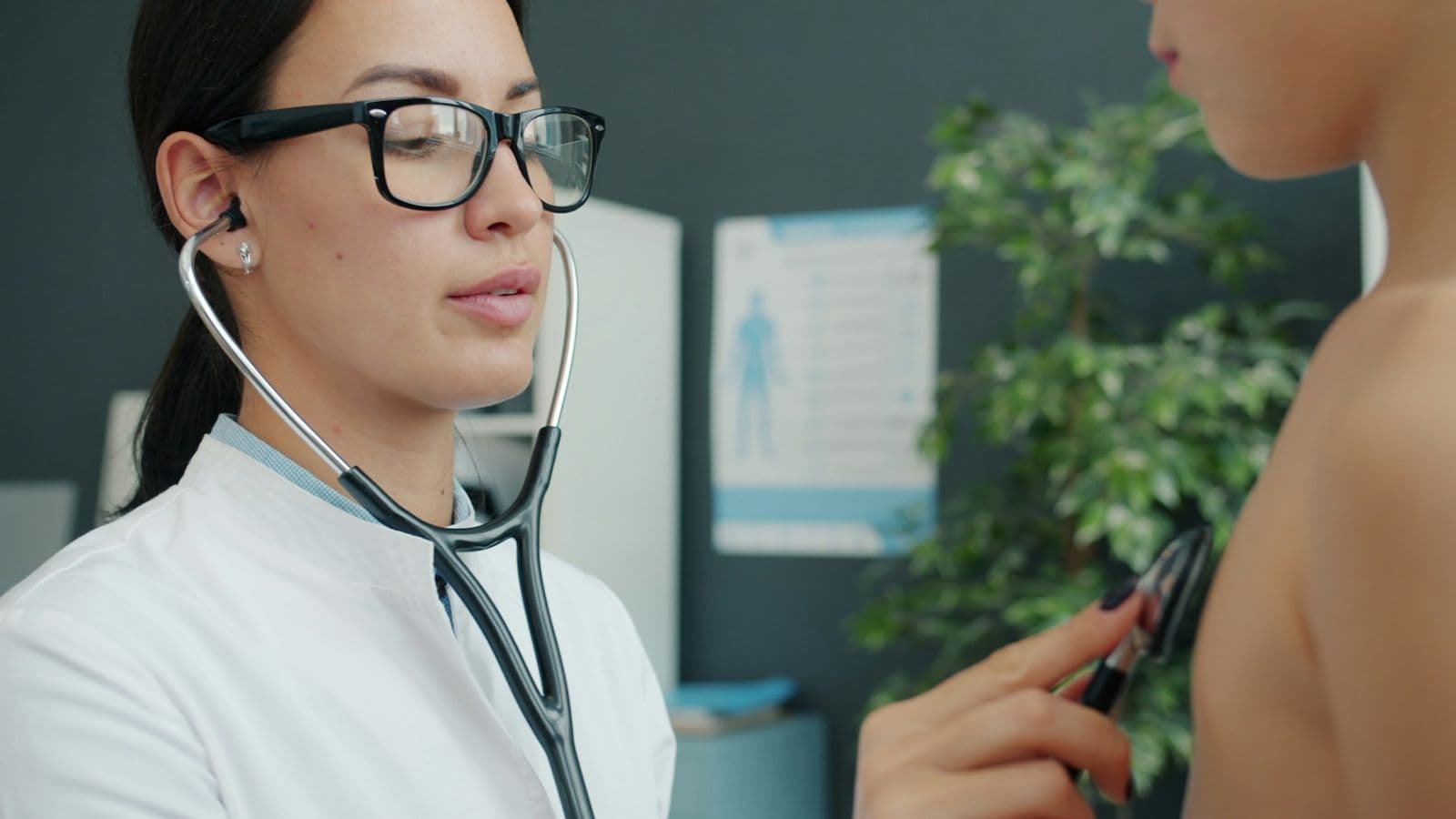 Doctor with a stethoscope talking to a patient