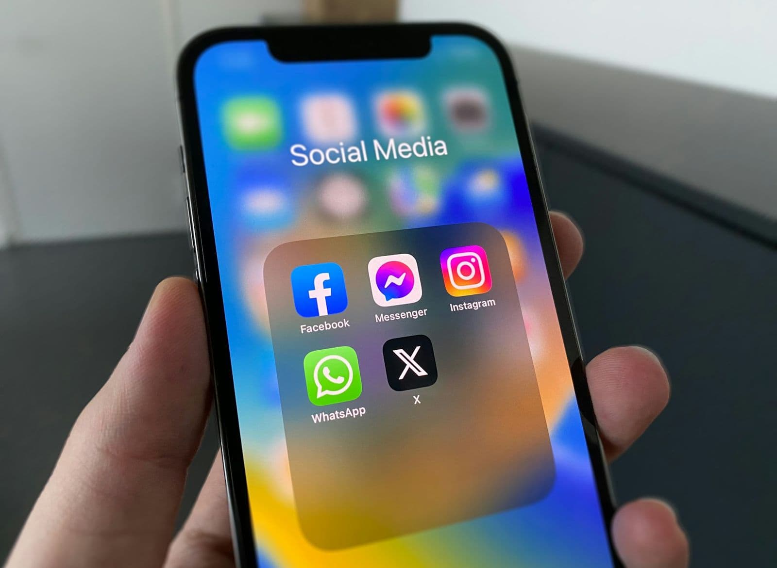 Phone showing a folder of social media apps